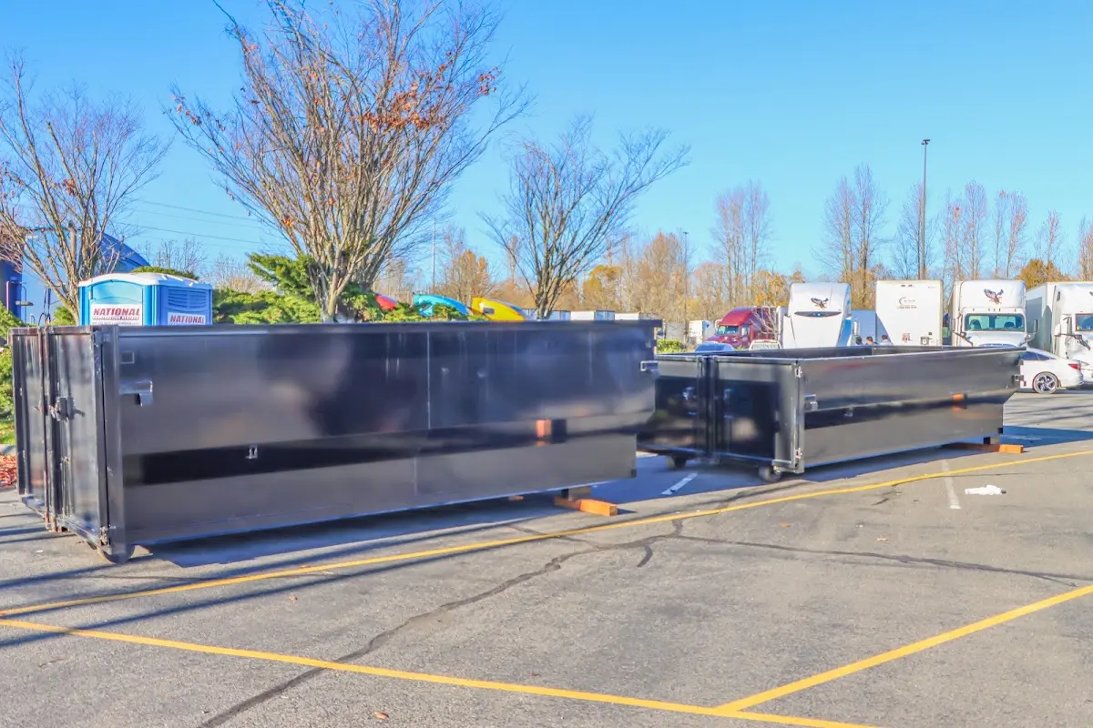 Professional dumpster rental service with roll-off container on residential driveway in Lombard